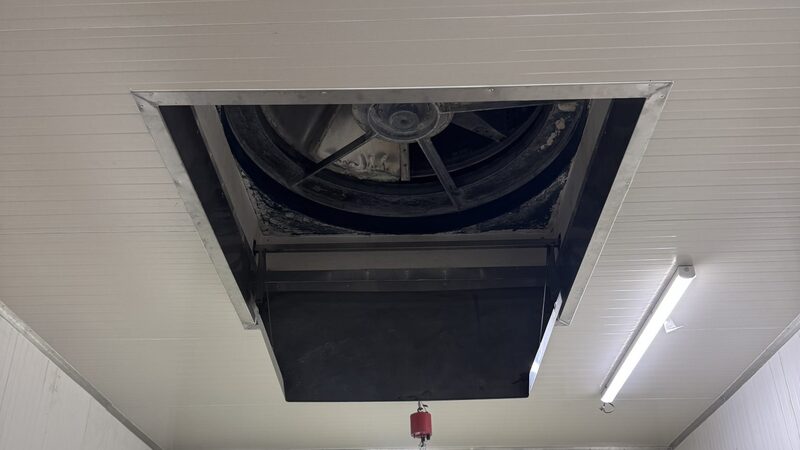 Circular extract fan set into a lined ceiling